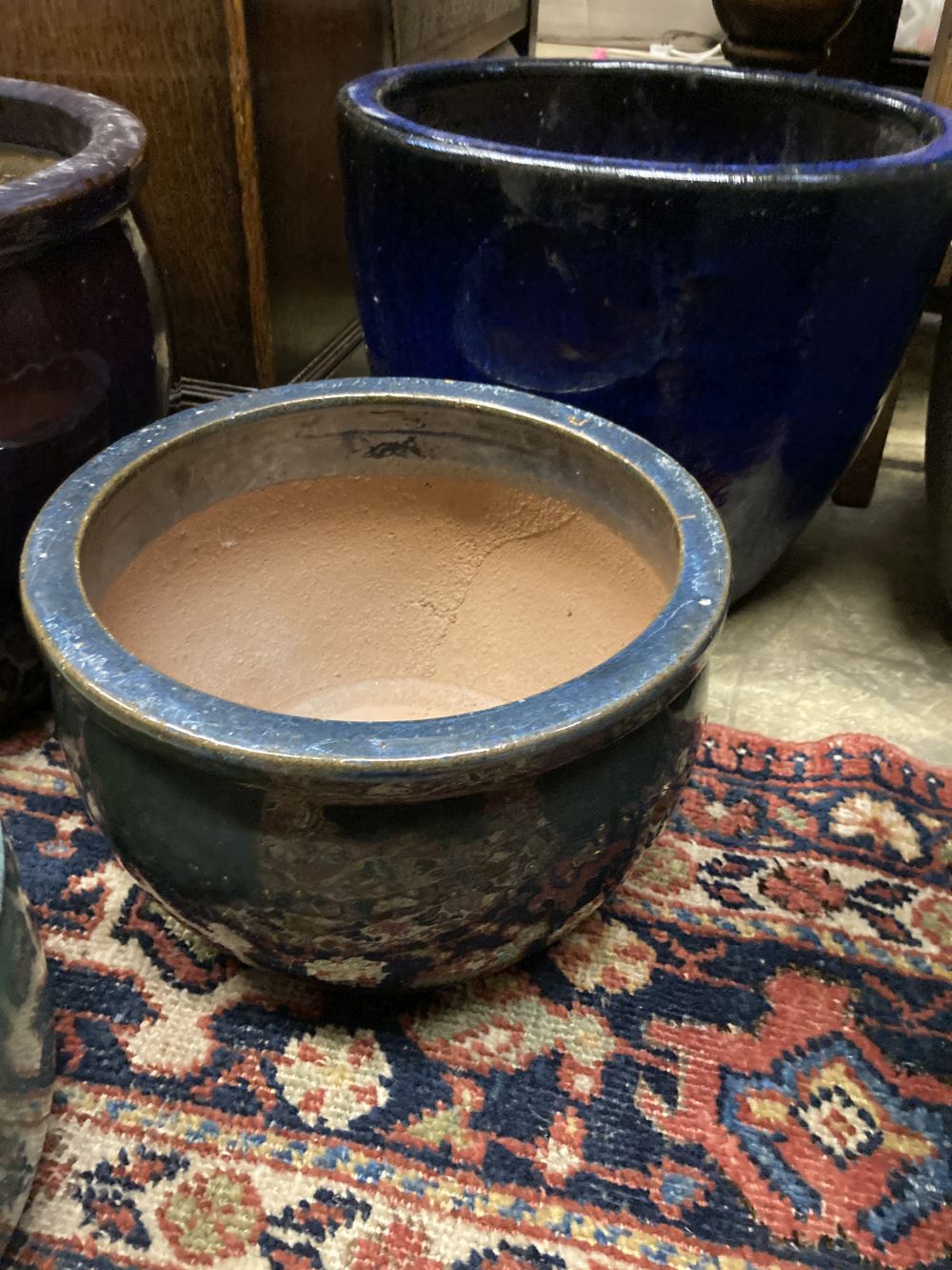 Four glazed earthenware garden planters, largest diameter 37cm